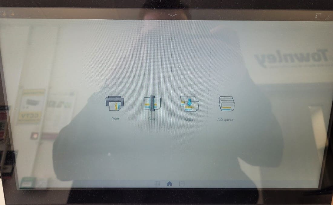 HP T1600 printer powered on and showing the home screen